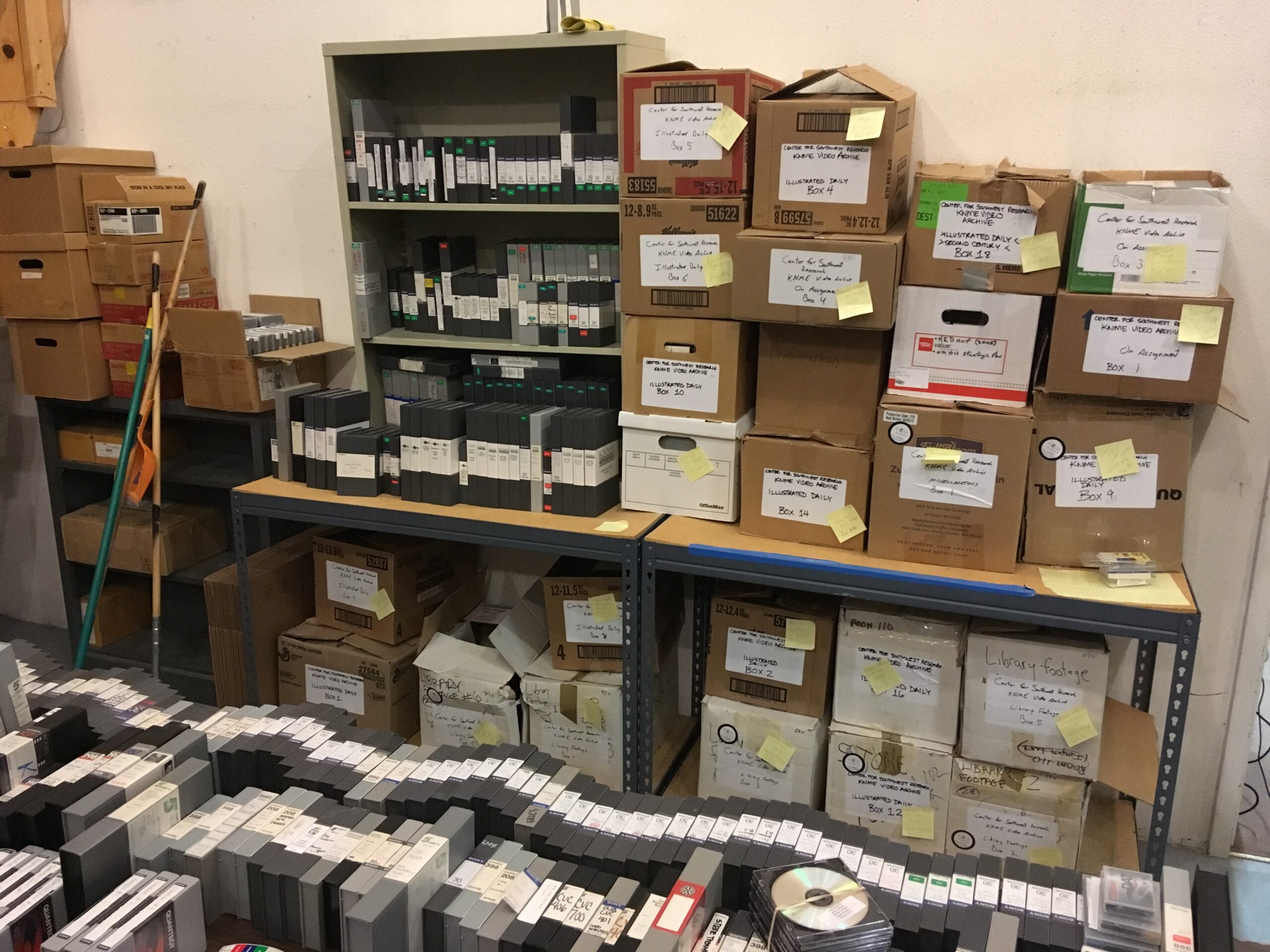 A room full of labeled boxes and assorted videotapes.